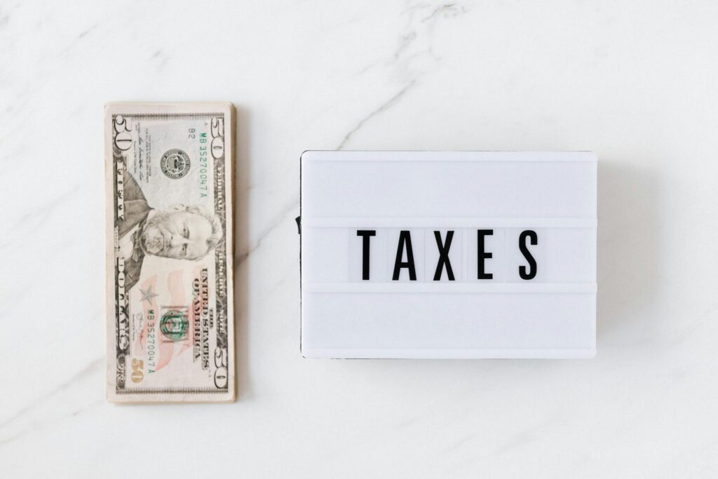 American dollar bills and vintage light box with inscription